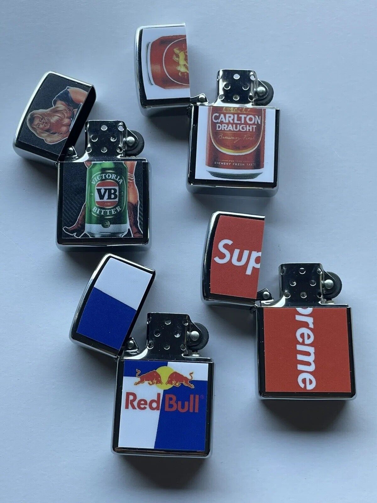 4 PCs Windproof Oil Lighters Set Supreme Red Bull VB And Carlton Draught Beers