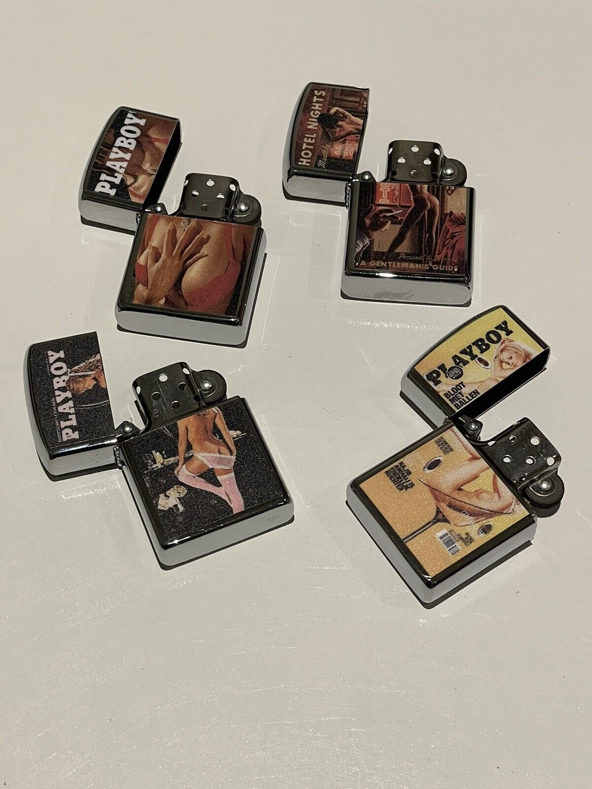4 PCs windproof Oil Lighters Unbranded  playboy cover  designs hotel nights