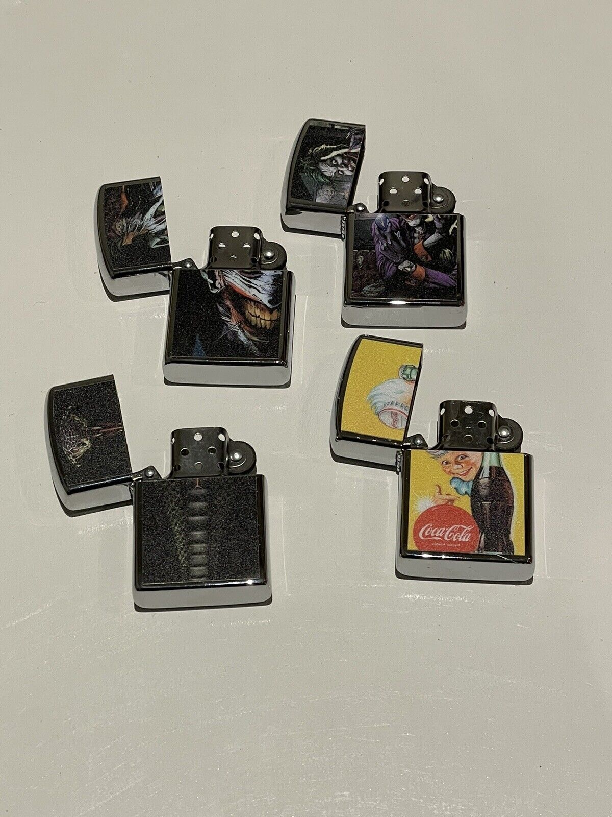 4 PCs windproof Oil Lighters Unbranded  joker king cobra coke designs quality
