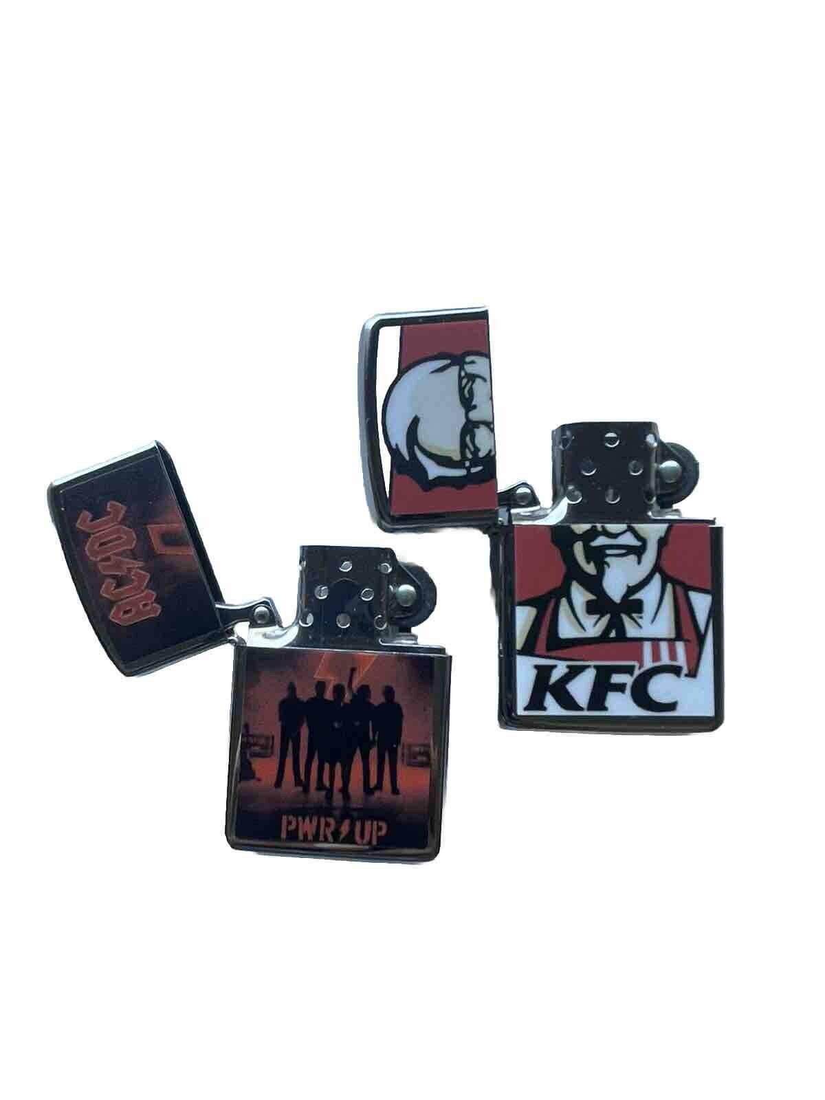 2 PCs Windproof Oil Lighters Set KFC And AC DC Band Designs  Novelty Gift